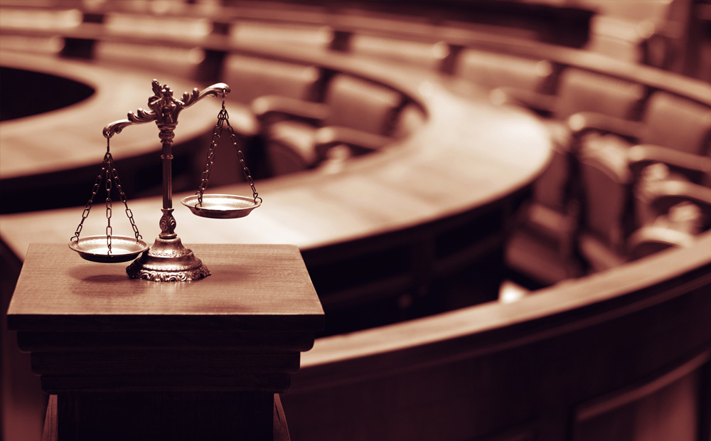commercial litigation inside courtroom balance scale of the law